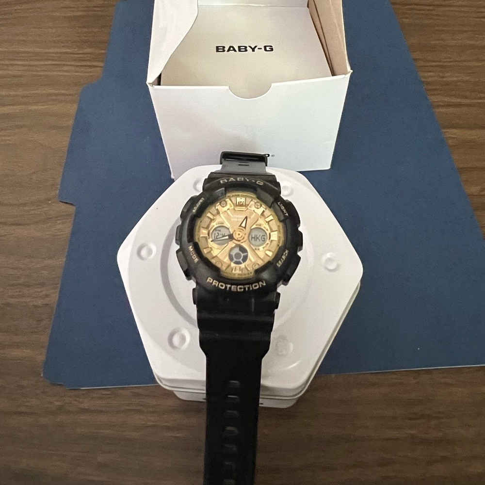 Unisex Baby G-Shock watch with Gold dial. Resin Band. Size 42mm.